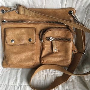 Fossil cross body leather purse.